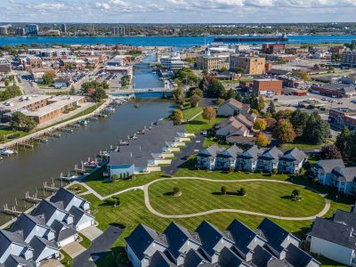 Stunning aerial view of Port Huron, Michigan featuring residential areas, waterways, and cityscape in summer.